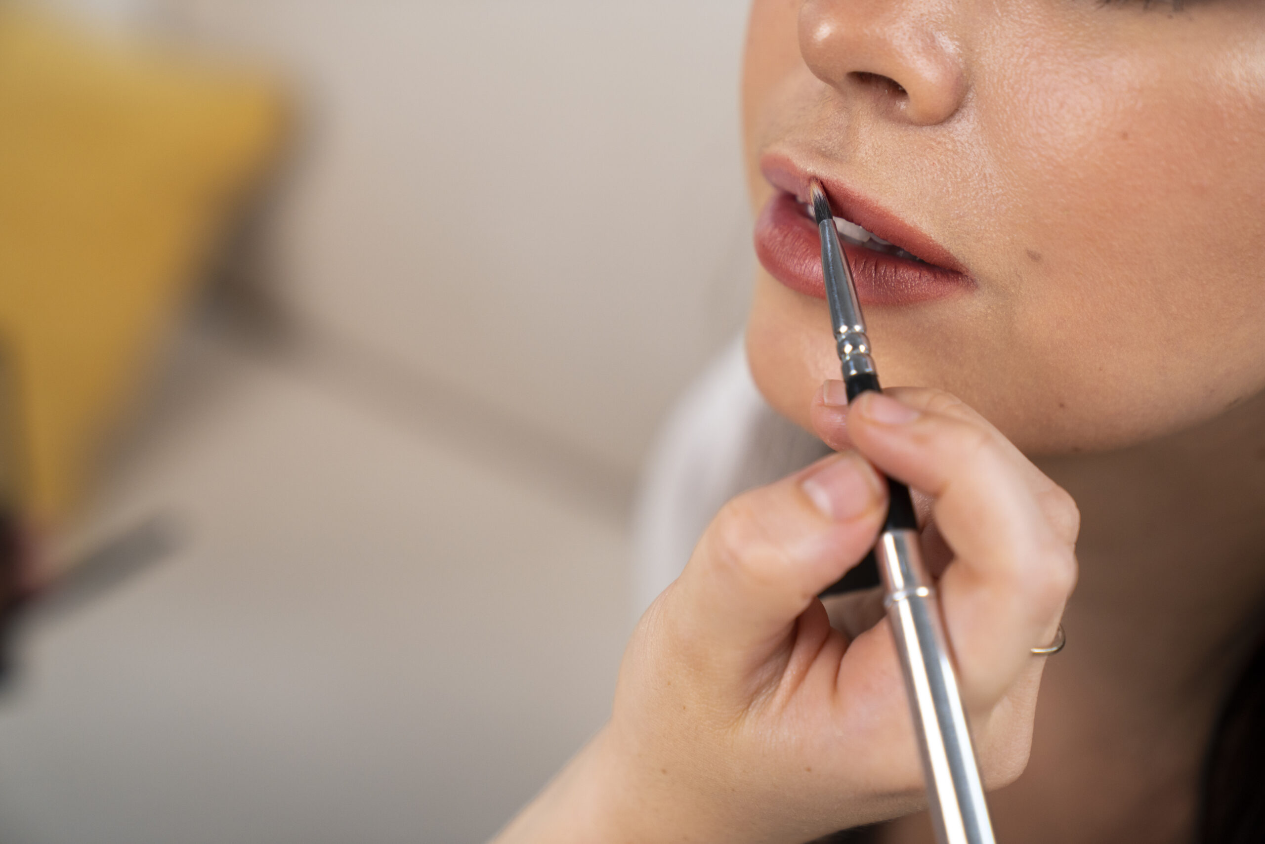 side-view-hand-holding-lip-brush side-view-hand-holding-lip-brush