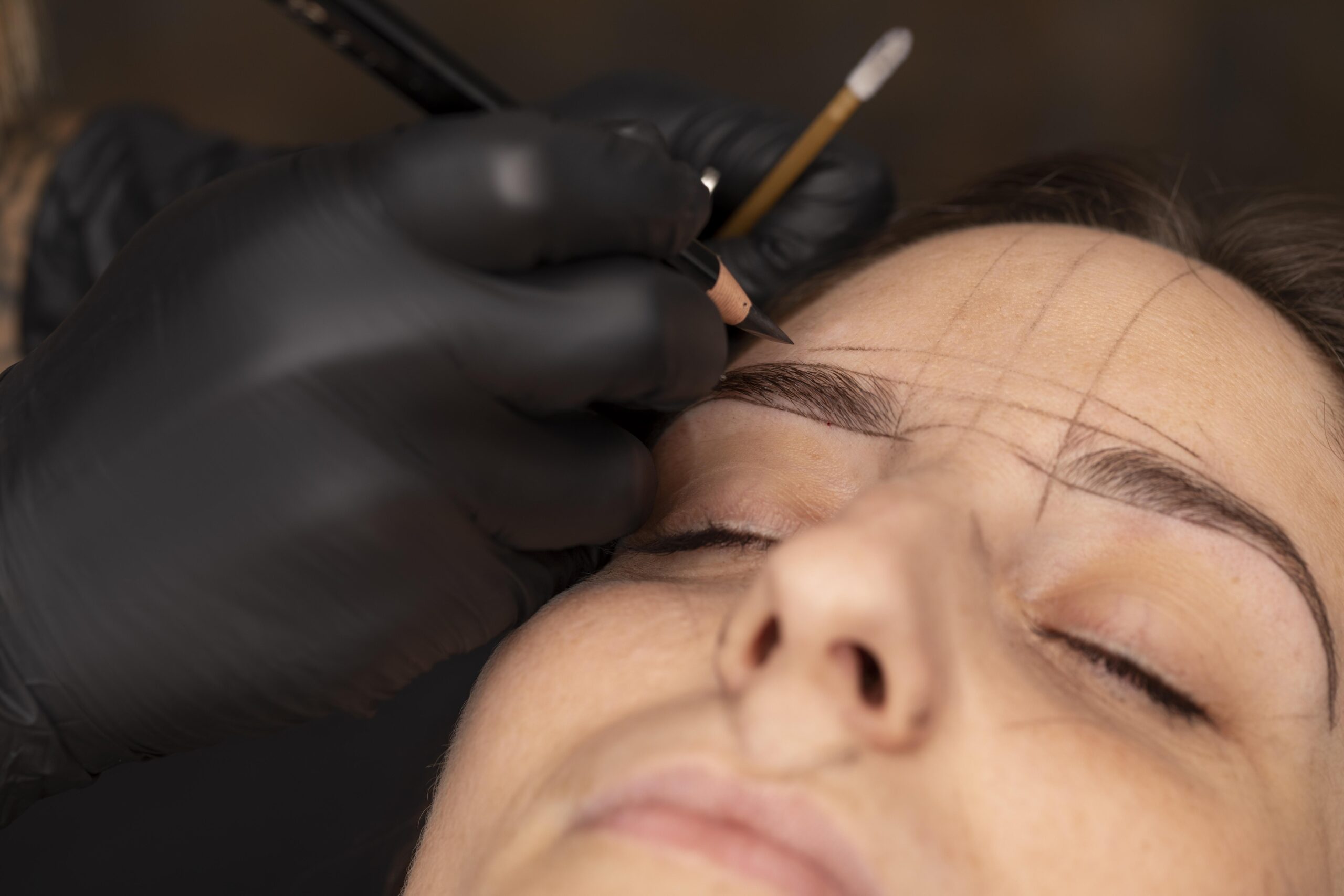 woman-going-through-microblading-treatment woman-going-through-microblading-treatment